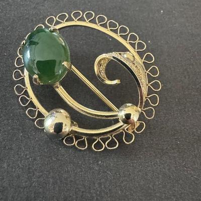 Vintage Gold Tone Brooch with a prominent Green Jade Cabochon