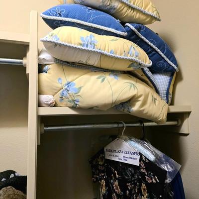 Sale Photo Thumbnail #63: Closet full of miscellaneous items including decor, florals, linens including a blue and yellow quilted daybed comforter set.