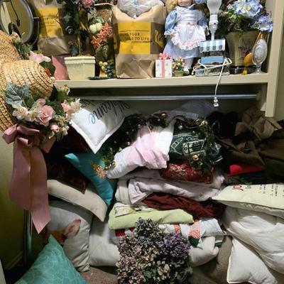 Sale Photo Thumbnail #60: Closet full of miscellaneous items including decor, florals, linens including a blue and yellow quilted daybed comforter set.