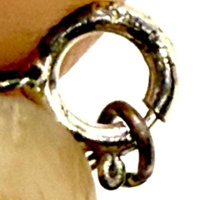 Sale Photo Thumbnail #159: 24" necklace chain. Cameo pendant opens to reveal 2 spaces for small oval photos. Oval stone looks to be made of onyx.