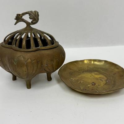 Sale Photo Thumbnail #32: 4-footed brass incense burner base with slotted one-piece lid.  Tray has a relief design of a French man wearing a beret and smoking a pipe. Both in good condition.