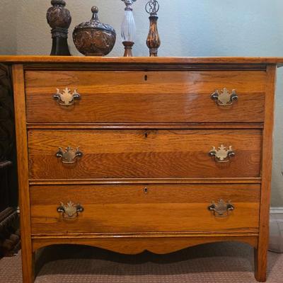 1 nightstand with 4 tabletop decor pieces.