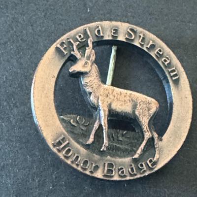 Field & Stream Honor Badges, one featuring a deer and the other a bear.