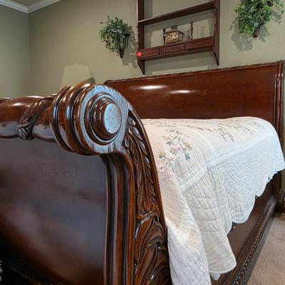 Sale Photo Thumbnail #85: King sleigh bed frame with headboard and footboard, 1 nightstand, and hanging wall shelf. Does not include mattress or bedding. `The matching 3 drawer nightstand measures 28.5"H x 30"W x 20"D. Does not include lamp. Lamps are in lot 17SS.
