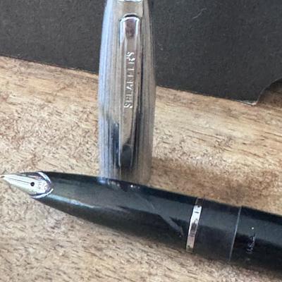 Sheaffer fountain pen identified by the "SHEAFFER'S" engraving visible on the pen's body.