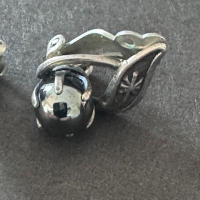 Vintage silver-tone clip-on earrings with a gray, spherical stone, likely hematite.