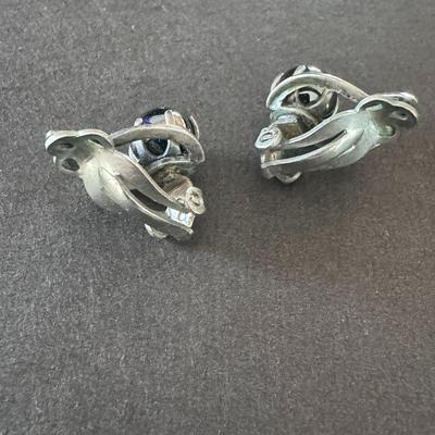 Vintage silver-tone clip-on earrings with a gray, spherical stone, likely hematite.