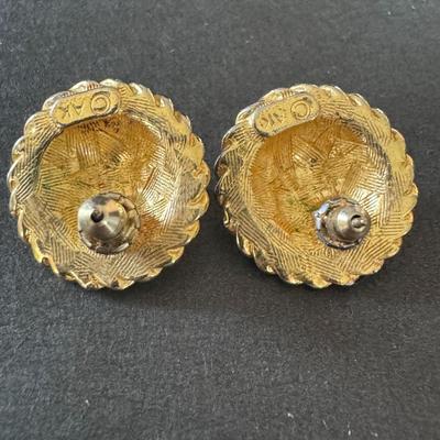 Gold-toned lion head stud earrings, a popular style associated with vintage designer jewelry