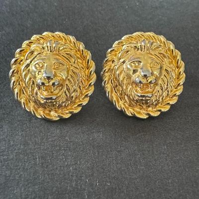 Gold-toned lion head stud earrings, a popular style associated with vintage designer jewelry
