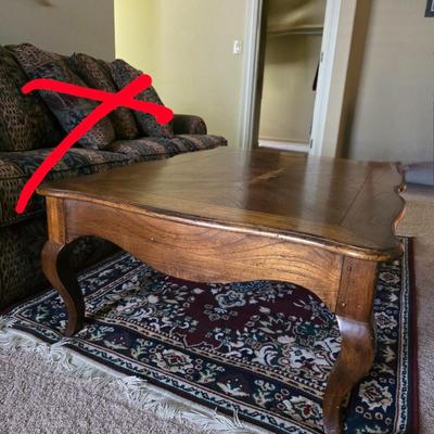 Sale Photo Thumbnail #133: Rectangle wood coffee table with area rug. Please see picture for defect on top of coffee table. Table measures 50"L x 36"W x 17.5"H.
Rug measures 4ft x 5ft.