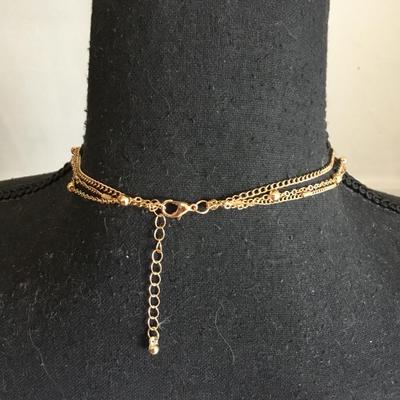 Super cute, gold toned, layered green crystal necklace