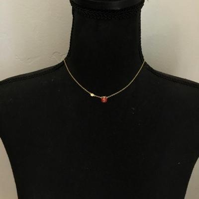 Super cute, dainty, very nice gold toned ladybug, flower necklace. Very nice quality.