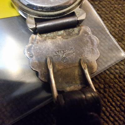 Sale Photo Thumbnail #117: the band is sterling and leather, the watch needs a new battery and is untested.  Not sure if the stones are turquoise or other stone.