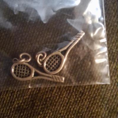 Sale Photo Thumbnail #137: these look a lot like a James avery charm and they were on a James avery bracelet but these two charms didn't have the James avery marking only the sterling mark.  So they were separated from the rest of the bracelet (already sold in previous auction)