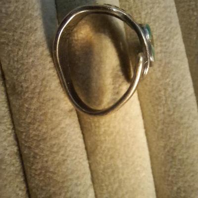 Sale Photo Thumbnail #148: see all photos.  Stone has scratches on it and ring isn't round.