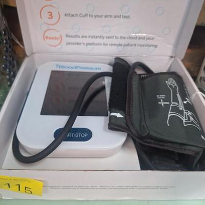 blood pressure monitor, book and jar