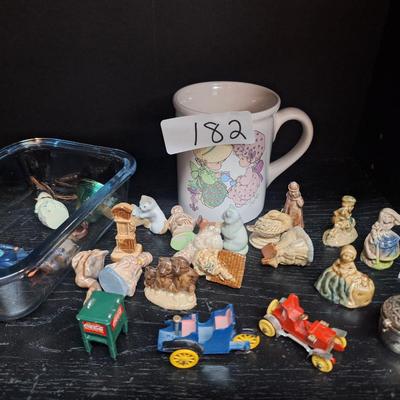 miniatures and a coffee cup
