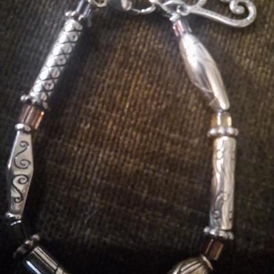 Bracelet- looks like a Premiere Designs Bracelet in a Brighton tin