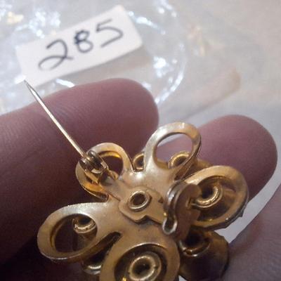 vintage pin with green jewels