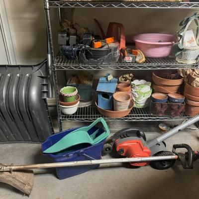 Wire Shelf with Miscellaneous Planters, Seasonal Decor and Seasonal Yard Tools