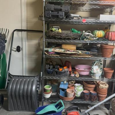 Wire Shelf with Miscellaneous Planters, Seasonal Decor and Seasonal Yard Tools
