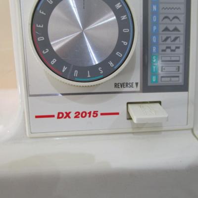Sale Photo Thumbnail #3: In excellent condition, Model DX2015, tested & works, has 17 different stitches & button hole, has extra sewing needles, includes case
