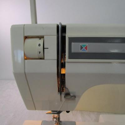 Sale Photo Thumbnail #7: In excellent condition, Model DX2015, tested & works, has 17 different stitches & button hole, has extra sewing needles, includes case