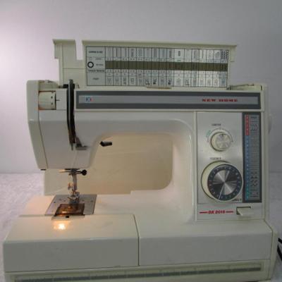 Sale Photo Thumbnail #1: In excellent condition, Model DX2015, tested & works, has 17 different stitches & button hole, has extra sewing needles, includes case