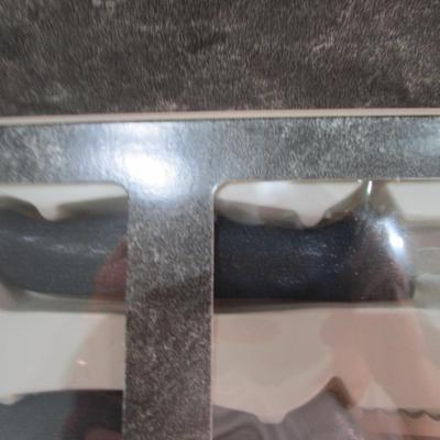 Sale Photo Thumbnail #598: New in box, Ginsu, blade is 7.25"