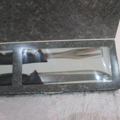 Sale Photo Thumbnail #593: New in box, Ginsu, blade is 7.25"