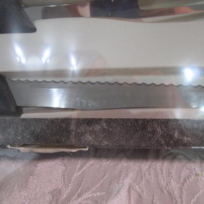 Sale Photo Thumbnail #596: New in box, Ginsu, blade is 7.25"
