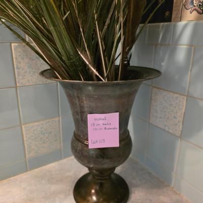 Brass vase with foliage
