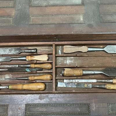 Sale Photo Thumbnail #711: Unsigned. Tool names include: Stanley Rule & Level Co., W. Butcher, and Henry Disston & Sons, among others. Measures 21.5" tall x 36.5" wide x 25.5" deep.