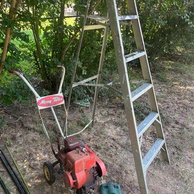 Sale Photo Thumbnail #175: Yard tools, fan, ladder, tiller, chair, hydraulic jack
Shelf does sale