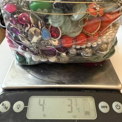 Sale Photo Thumbnail #13: Bag of costume jewelry (rings, bracelets, necklaces, earrings) weighting 4lb 3 3/4oz
Wearable fashion, some need cleaning. Metal not tested. Find your treasure