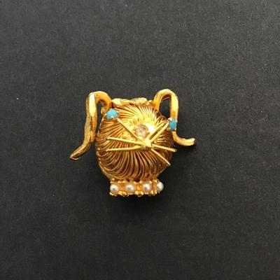 Animal head spiral brooch