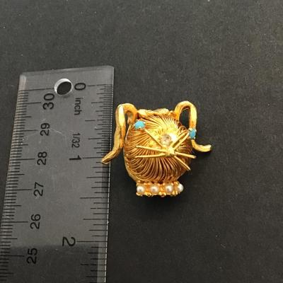 Animal head spiral brooch