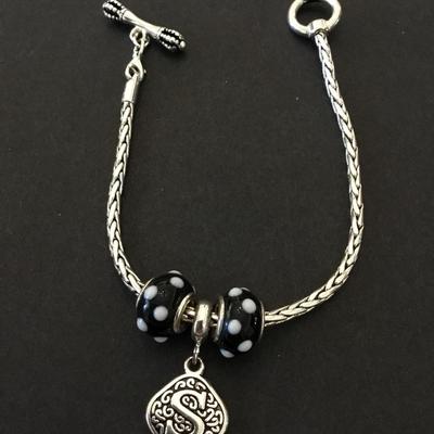 Very nice silvertone toggle bracelet, S charm