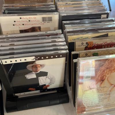Sale Photo Thumbnail #360: Dvds, Cassettes, Dvds, cabinet and more.

Holders for CDs not included.