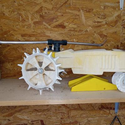 Tackle box and tractor lawn sprinkler