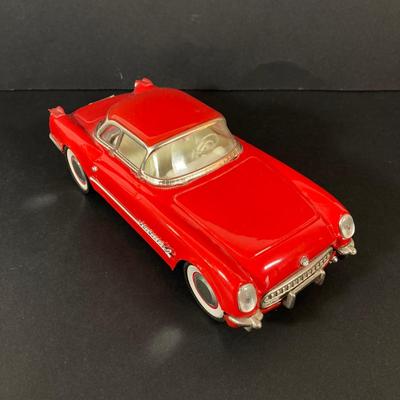 LOT 131: Vintage Metal 53 Red Corvette, The National Corvette Museum Blue Flame 53 Print, 3 Dimensional Wall Plaque and Two Diecast...