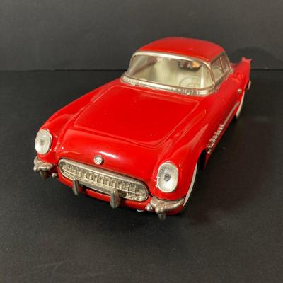 LOT 131: Vintage Metal 53 Red Corvette, The National Corvette Museum Blue Flame 53 Print, 3 Dimensional Wall Plaque and Two Diecast...