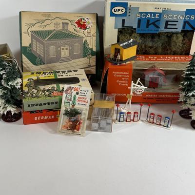 LOT 196: Vintage Minitures Including Building Trees, Gas Pumps and Toy Soldiers In Original Boxes