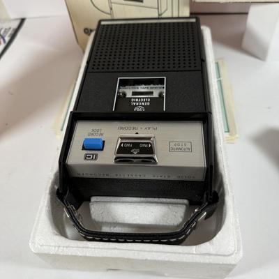 LOT 200: Vintage Electronics - GE 3-5002 Tape Recorder with Mic, Unopened GE AM/FM Compact Portable Radio 7-2800 and a Texas Instruments...