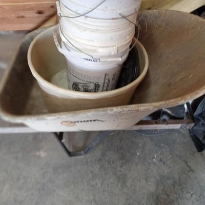 Wheel barrel and lawn seeder