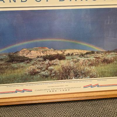 Sale Photo Thumbnail #2: This is a larger print.  Called Land of Dakota is professionally framed, signed and numbered.  Is a great piece of North Dakota history. This celebrates 100 of ND statehood.  Has certificate and information about the piece.  Painted in 1983 this is 57 of 