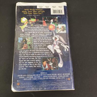 LOT 64: Sealed VHS Jetsons Collection & Space Jam with Collectors Coin