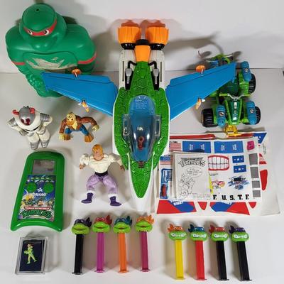 LOT 86: Vintage Teenage Mutant Ninja Turtles Toy Lot Including Pez Dispensers, Handheld Videogame and More