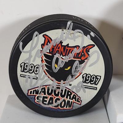 LOT 93: Many Autographed Hockey Pucks by Various Players from Philadelphia Flyers, New Jersey Devils and More