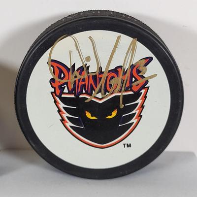 LOT 93: Many Autographed Hockey Pucks by Various Players from Philadelphia Flyers, New Jersey Devils and More